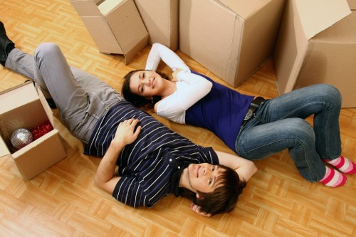 Professional movers handling furniture disposal